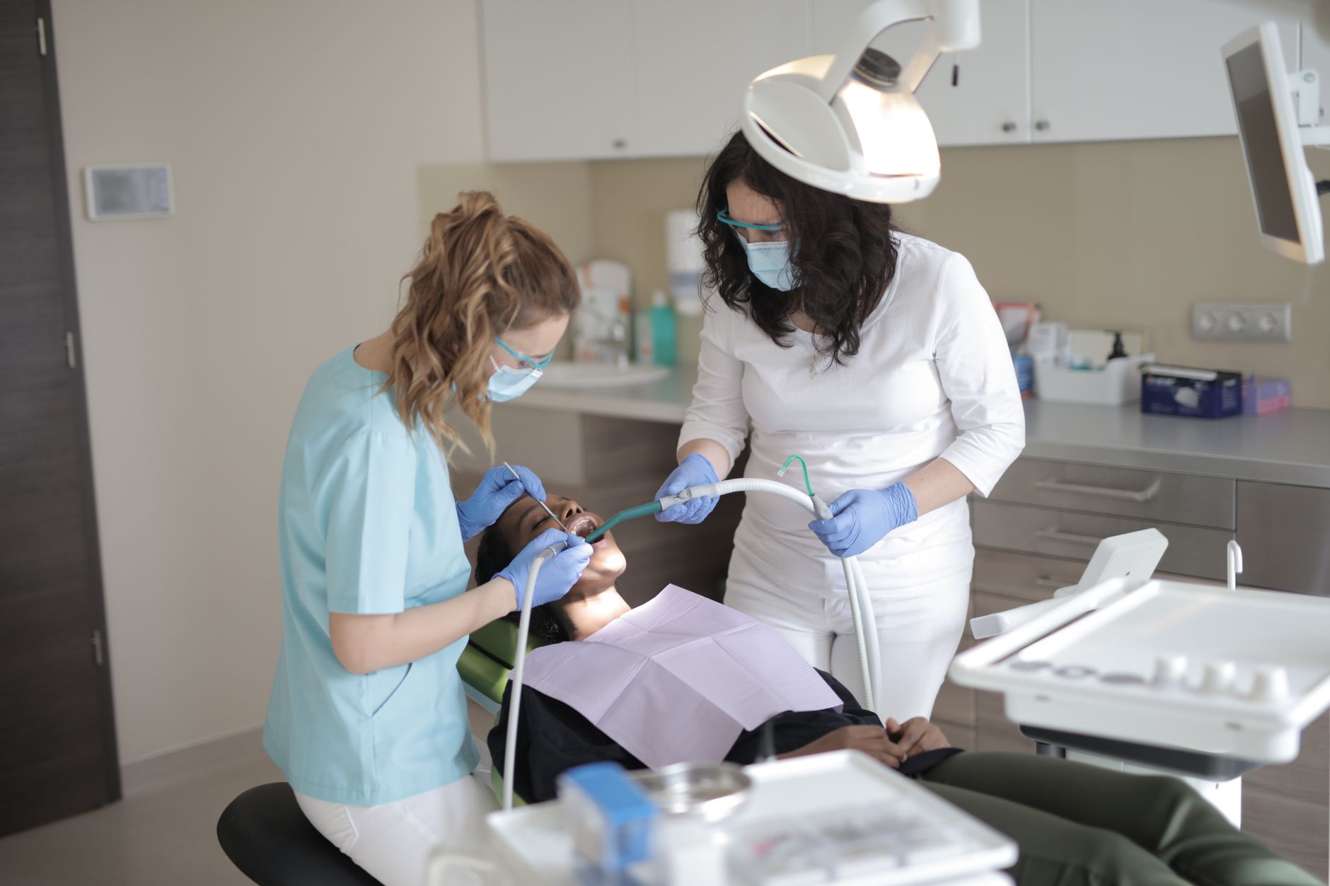 dentist treating patient tooth