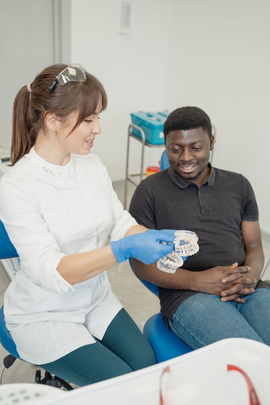 dentist discussing dental care patient