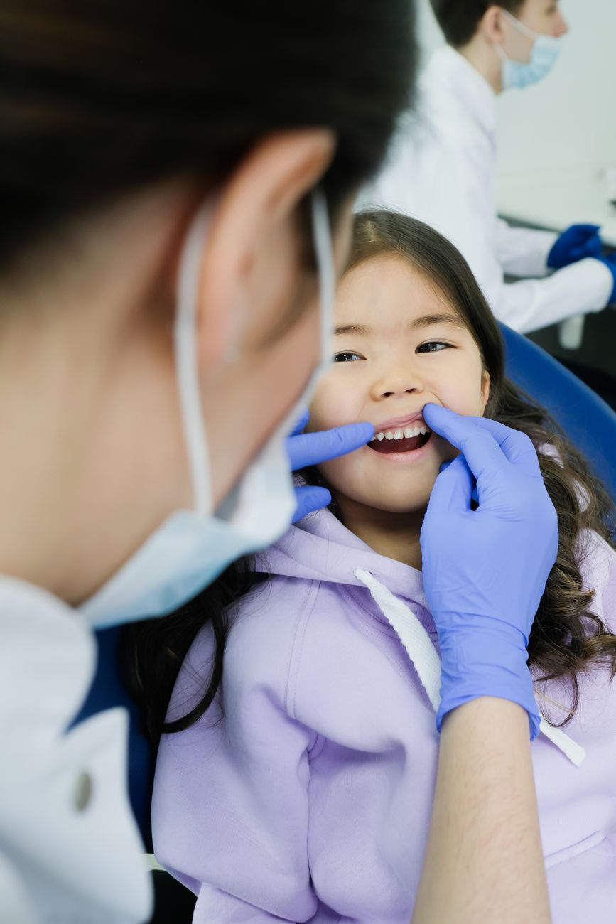 pediatric dentist with child patient