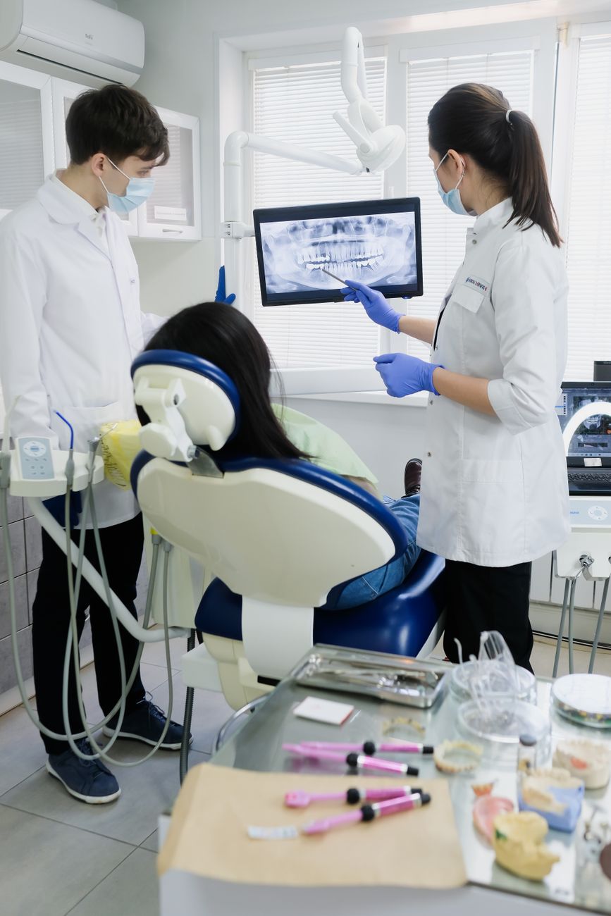 dentist discussing clear aligners patient